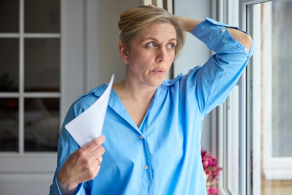 Middle aged woman going through hot flashes and in need of BHRT.