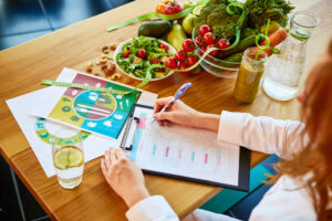 Provider working on creating and nutritional dietary plan for a patient with food sensitivity.